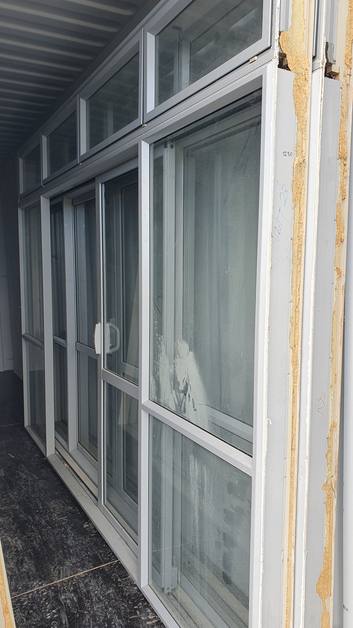 Bi-parting sliding door with opening windows 2300 H x 3235 W