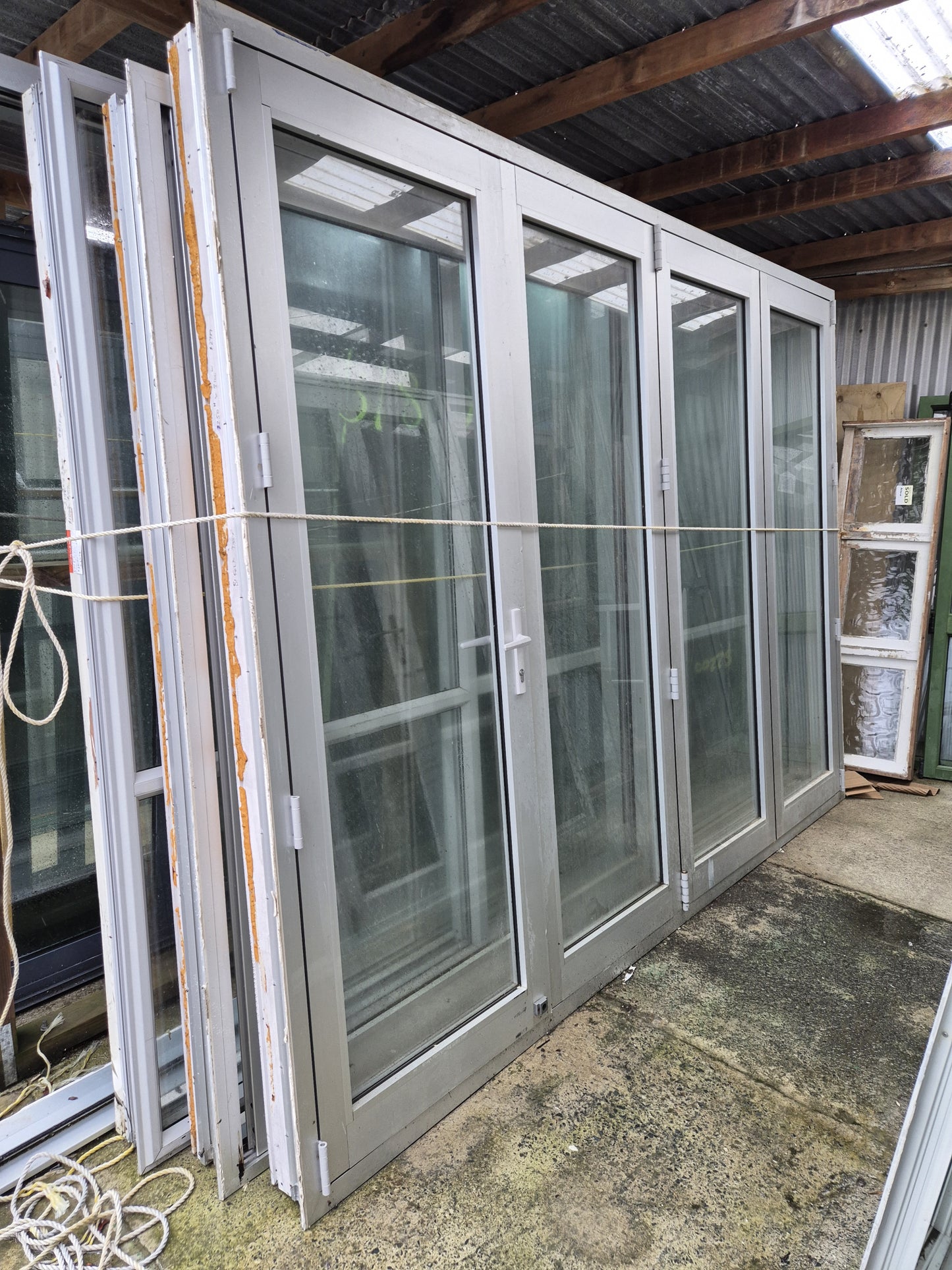 Silver Bifolding Door with Access Door 2250 H x 3100 W #B1921