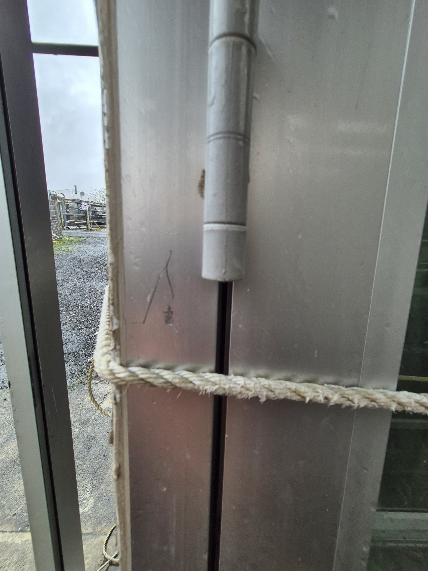 Silver Bifolding Door with Access Door 2250 H x 3100 W #B1921