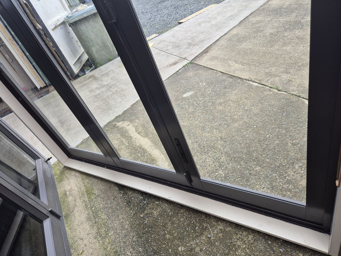 Ironsand Bifolding Door with Access Door 2140 H x 2000 W #2099