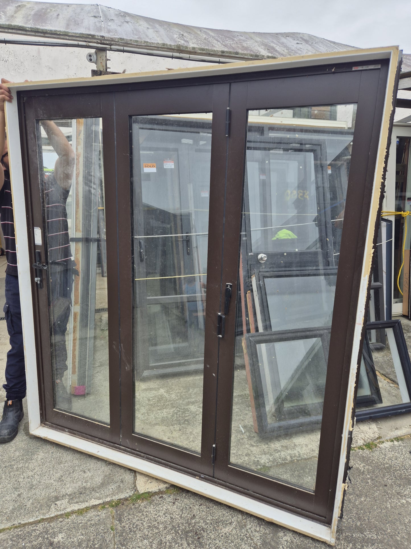 Double Glazed Brown Bifold Door with Outside Access Door 1980 H x 1800 W #2190