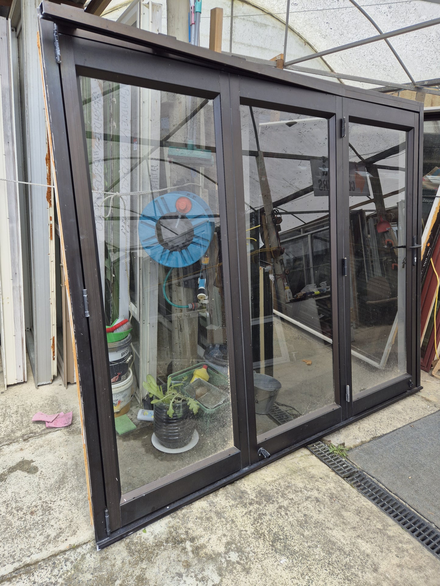 Bronze Bifolding Door with Access Door 2 m H x 2.4 m W #2235 - Folds flush