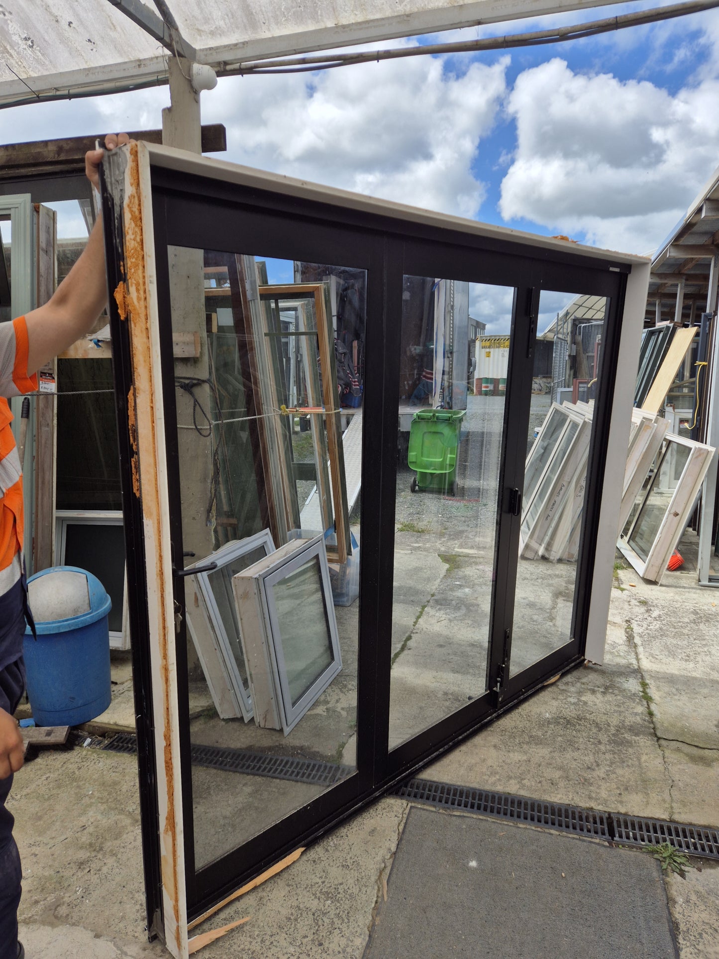Bronze Bifolding Door with Access Door 2 m H x 2.4 m W #2235 - Folds flush
