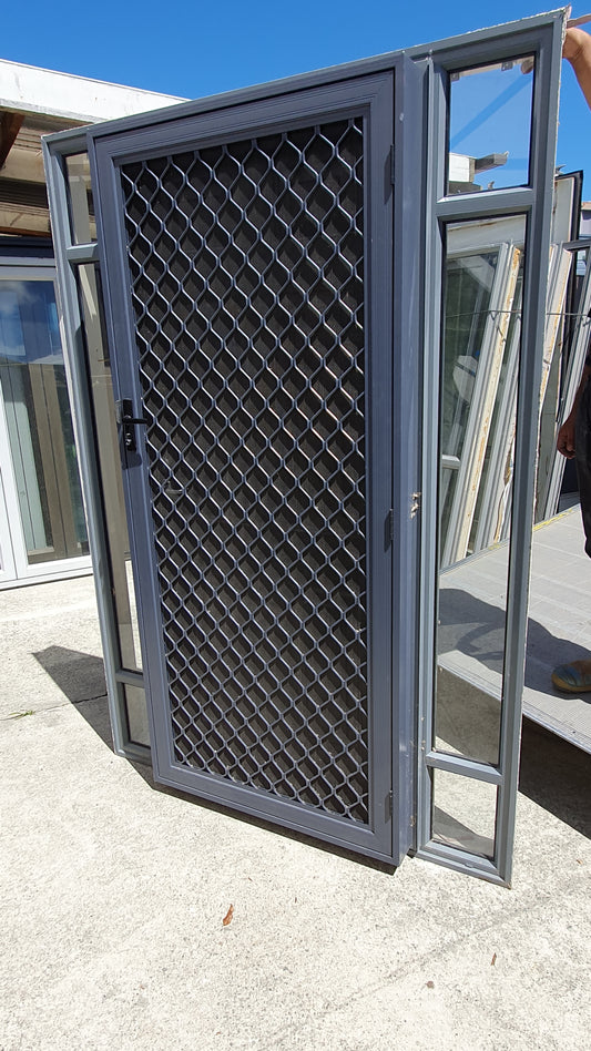 Entrance door with sidelights & security grille/ flyscreen fitted