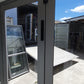 Anodised Silver Bifolding door with outside access door 2015 H x 2090 W