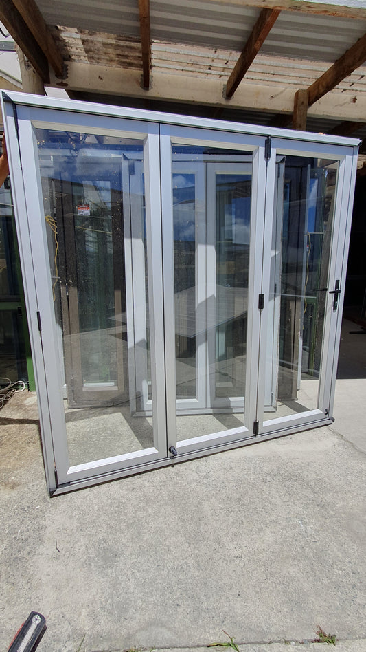 Anodised Silver Bifolding door with outside access door 2015 H x 2090 W