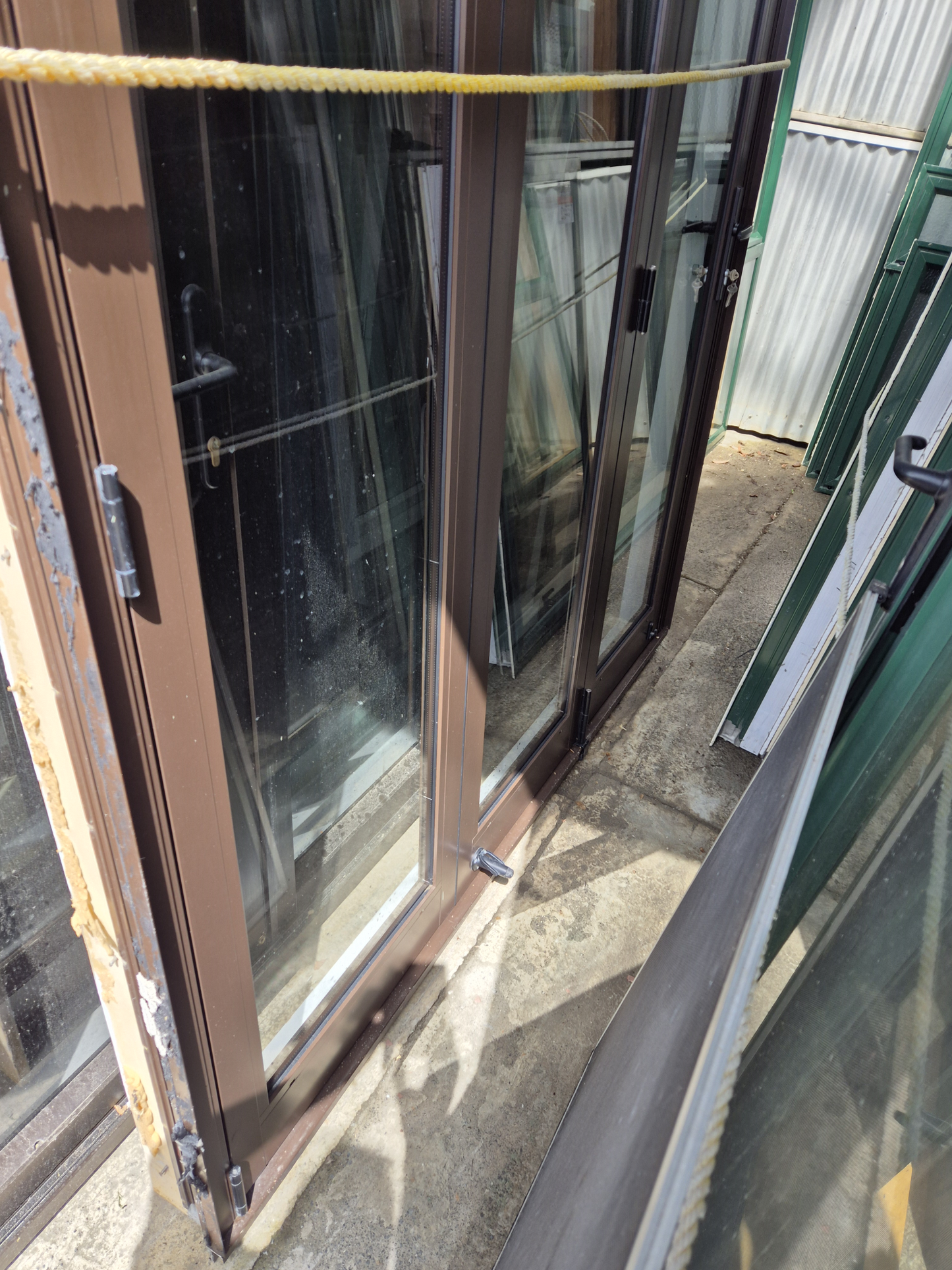 Double Glazed Brown Bifold Door with Outside Access Door 1980 H x 1800 W #2190