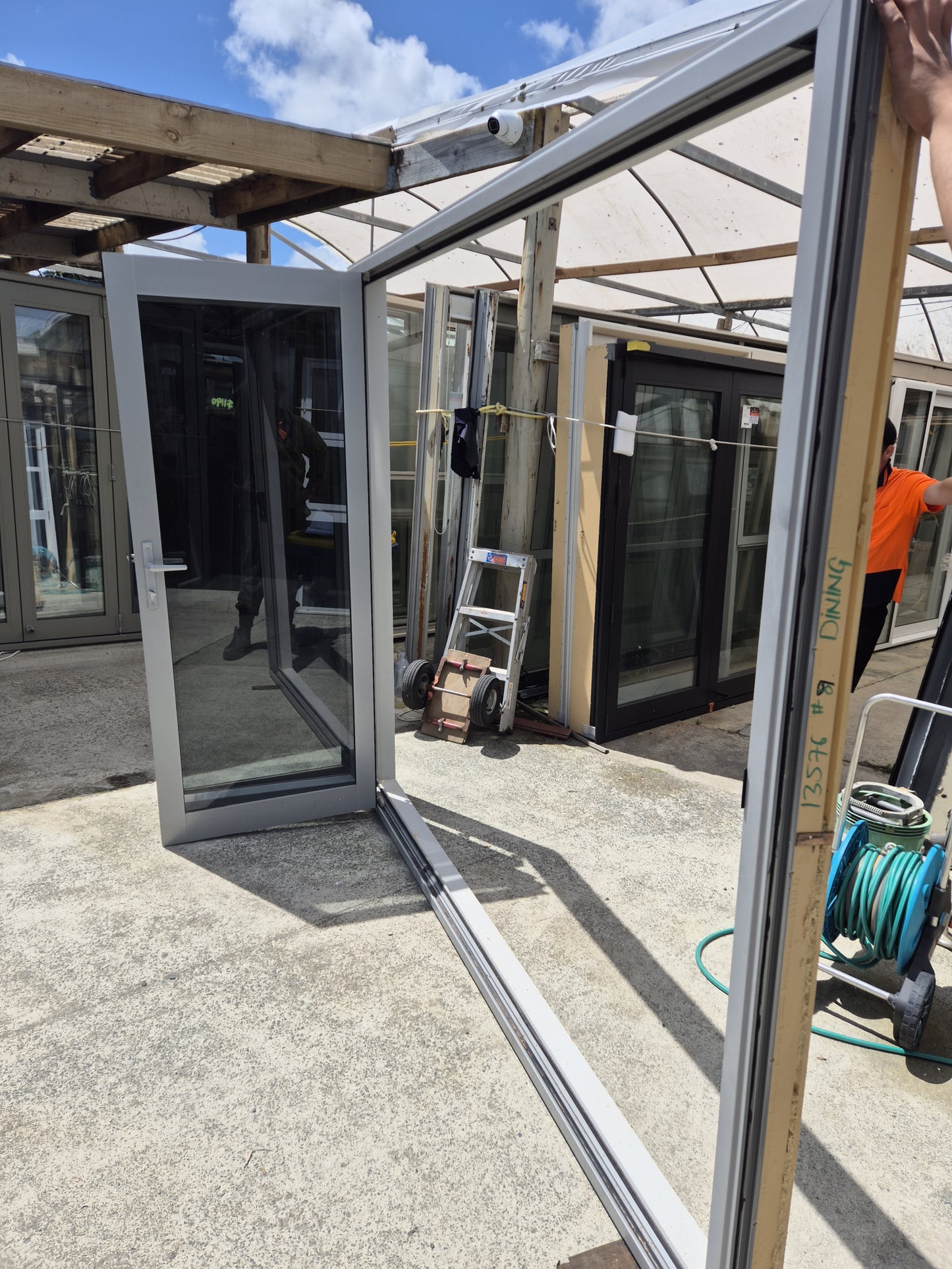 Bifolding door with outside access door 2m H x 2.4W #2077 (2 available)