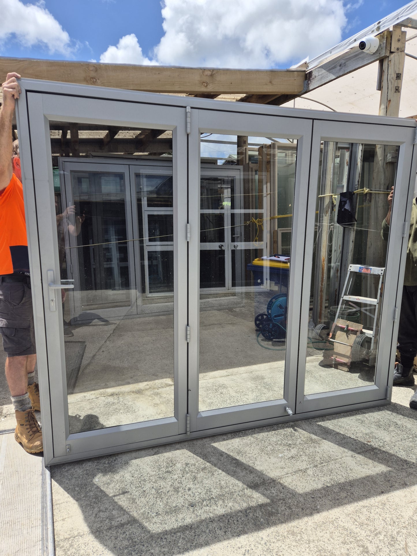 Bifolding door with outside access door 2m H x 2.4 W #2078