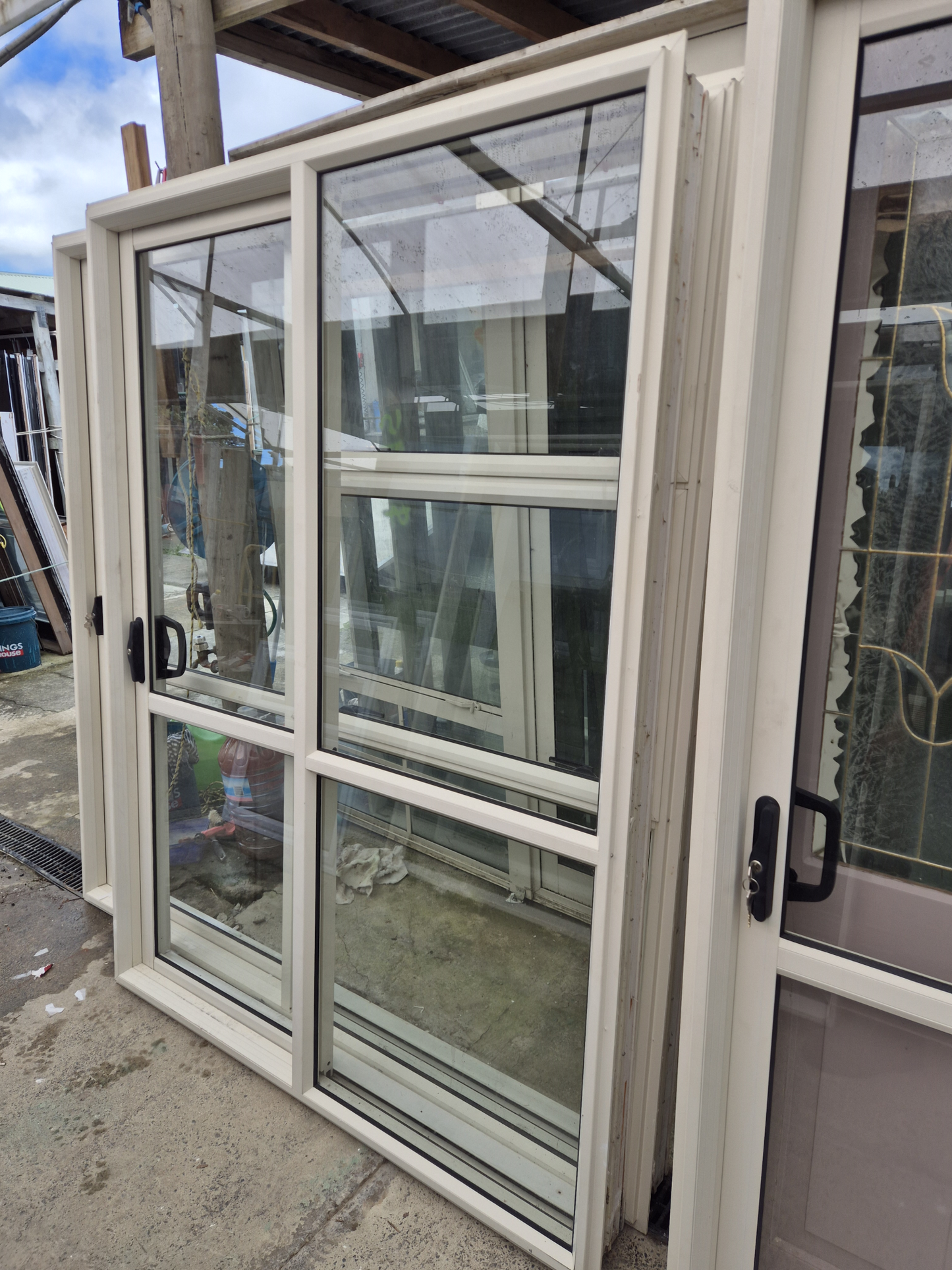 Lot of Cream Joinery, priced individually. Ranchsliders, Leadlite door, Windows