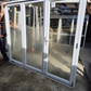 White Bifold door with external access door 2045 x 2460W #2075