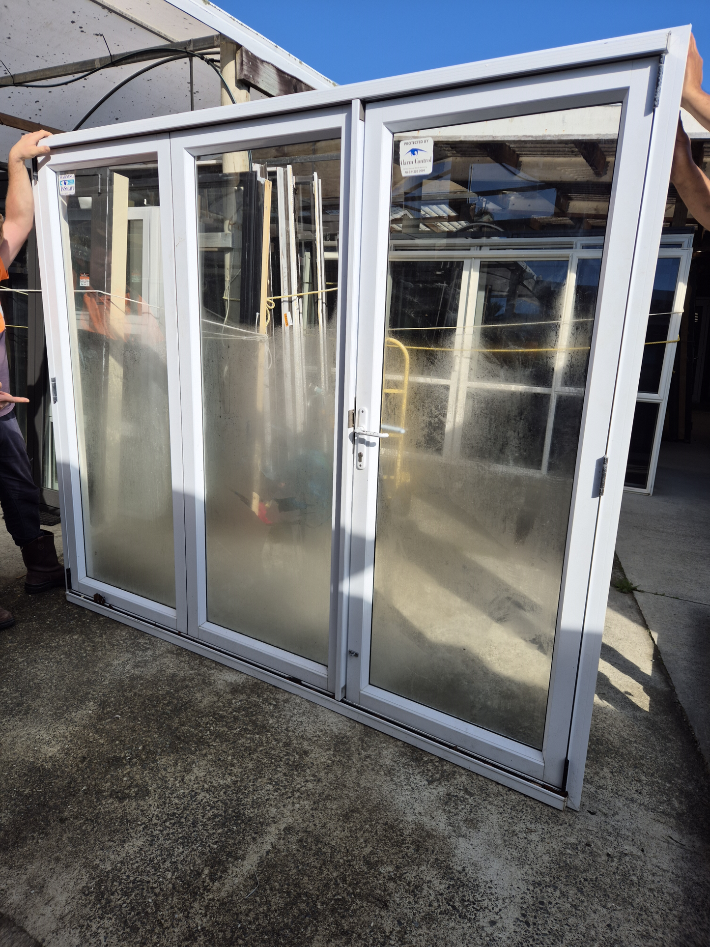 White Bifold door with external access door 2045 x 2460W #2075