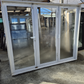 White Bifold door with external access door 2045 x 2460W #2075