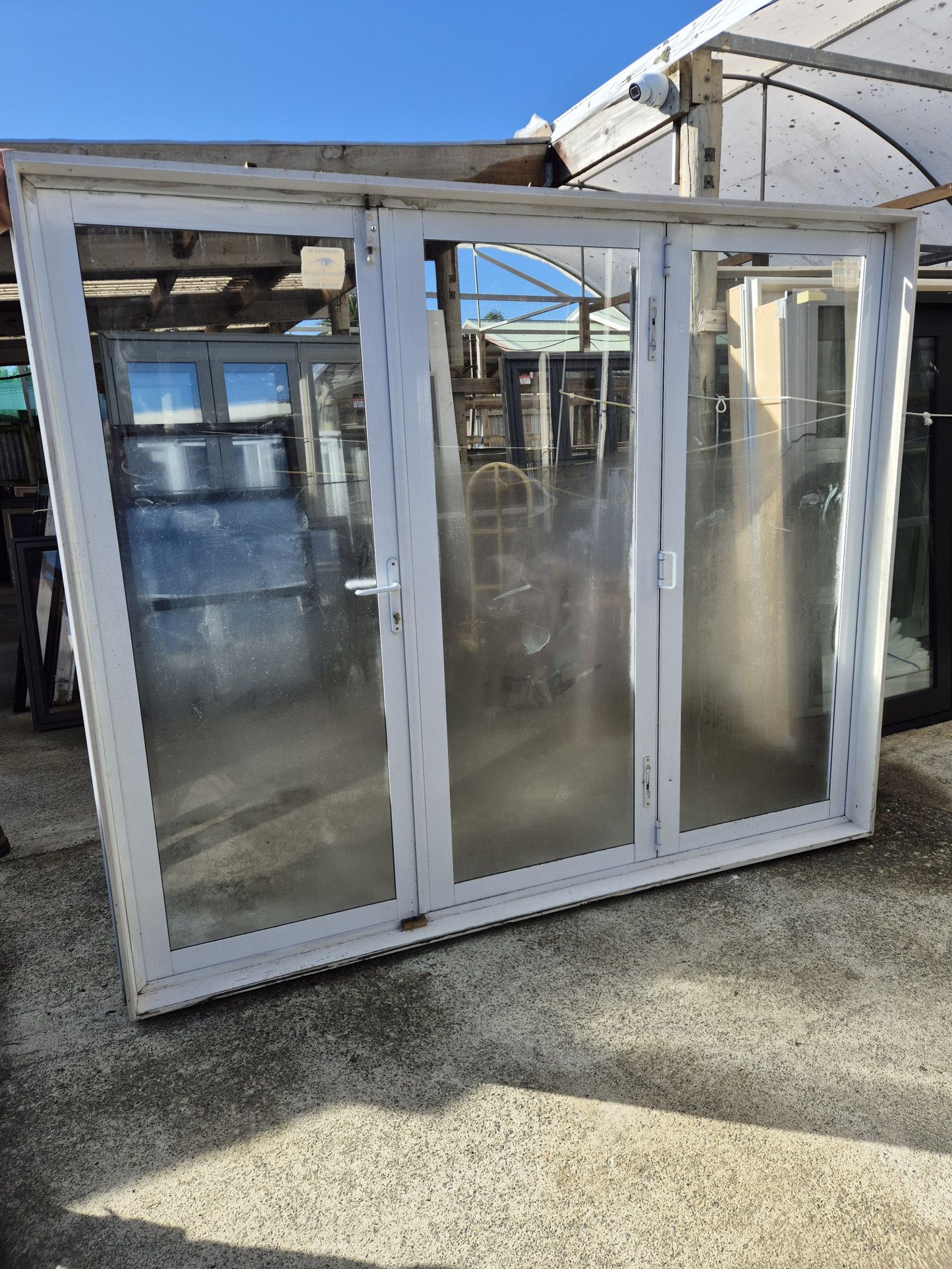 White Bifold door with external access door 2045 x 2460W #2075