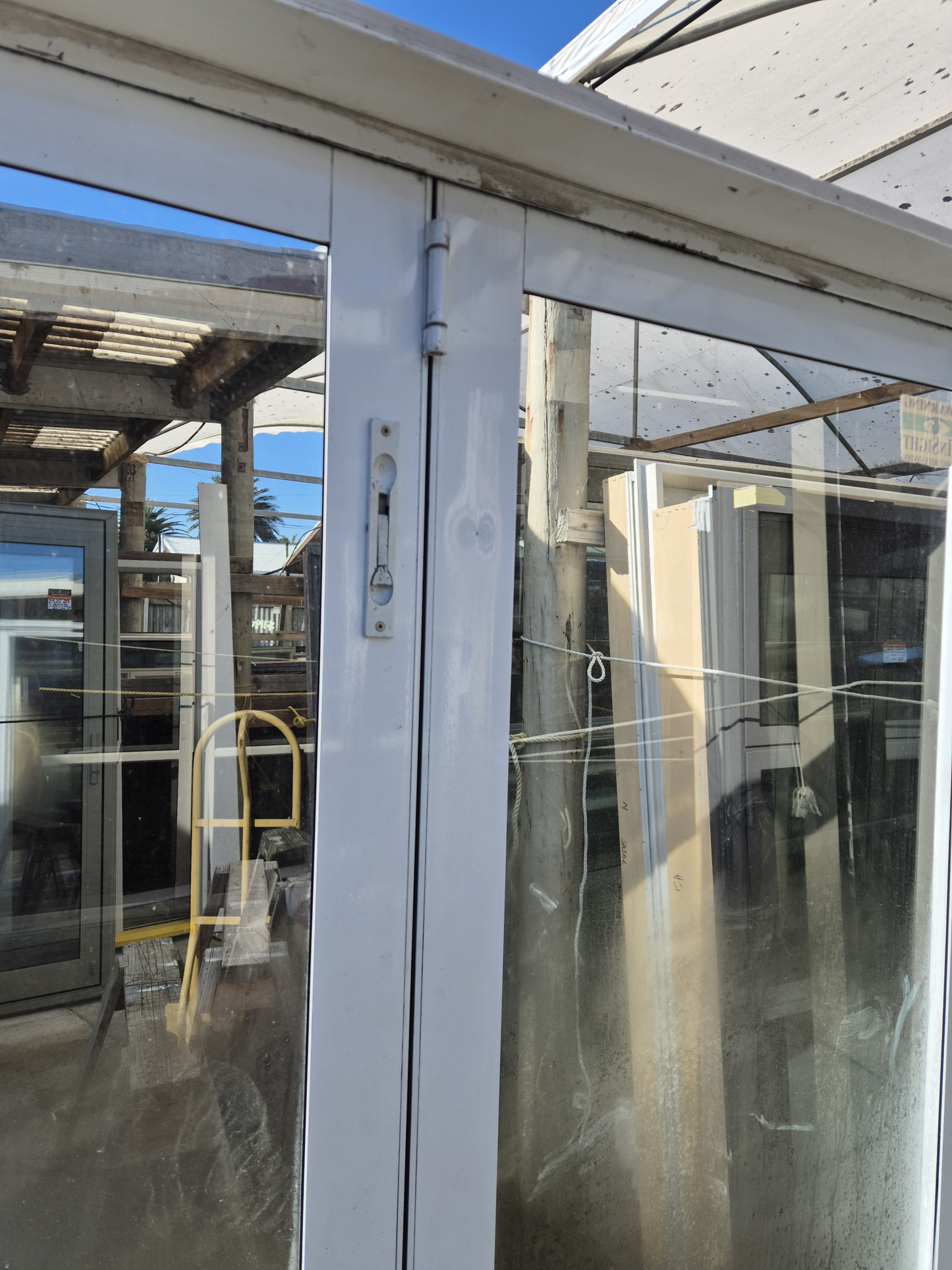 White Bifold door with external access door 2045 x 2460W #2075