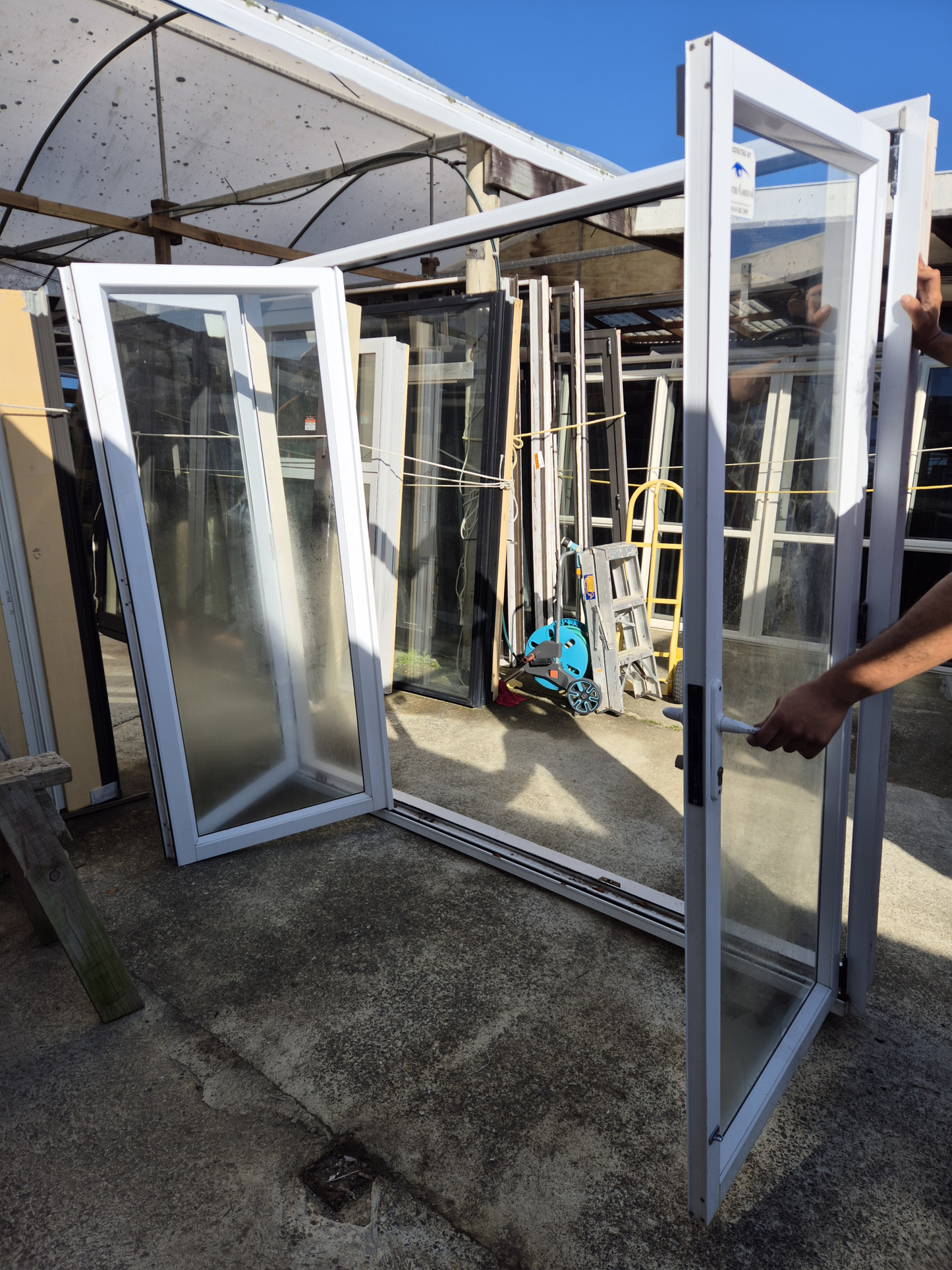 White Bifold door with external access door 2045 x 2460W #2075