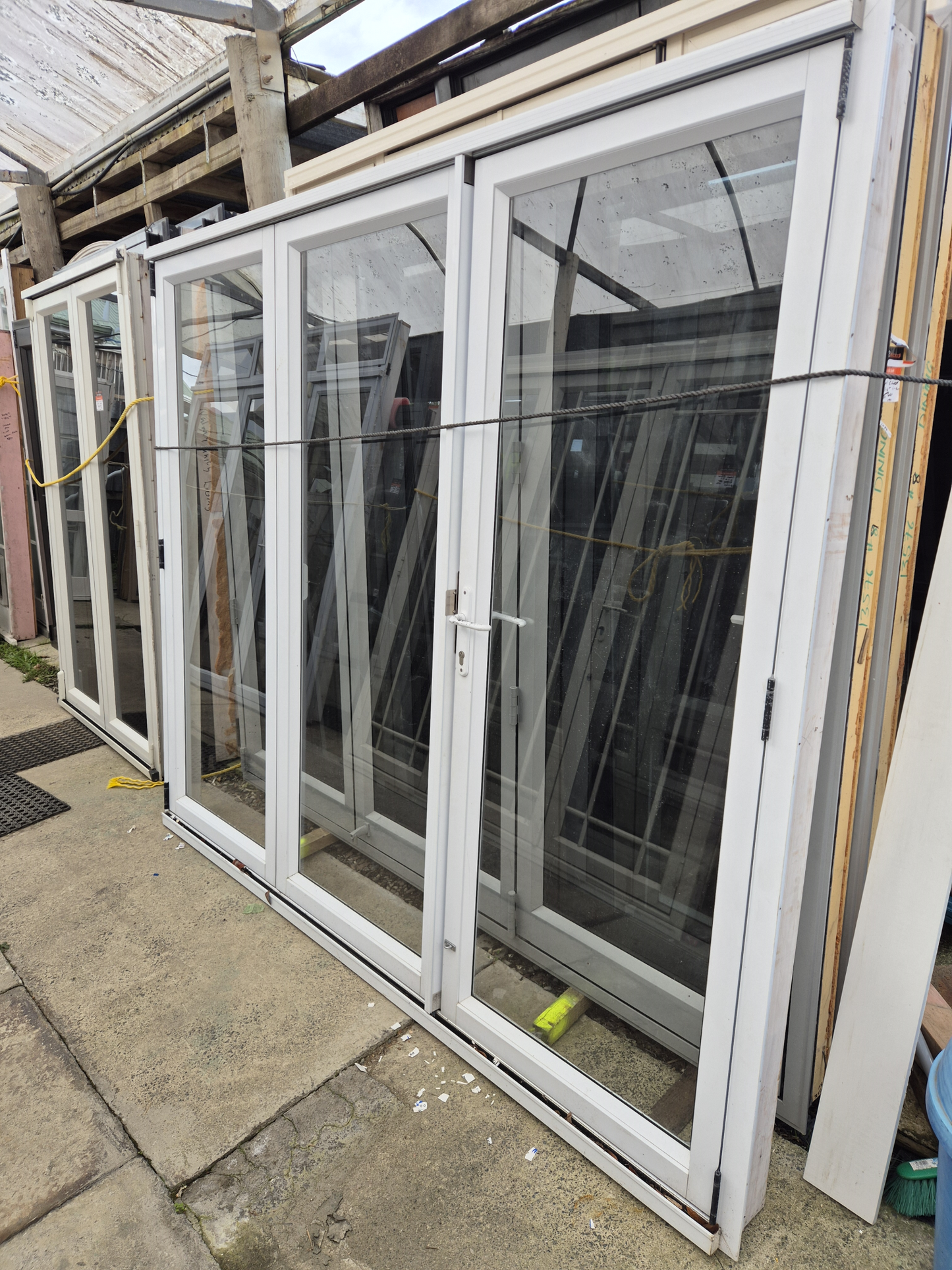 White Bifold door with external access door 2045 x 2460W #2075