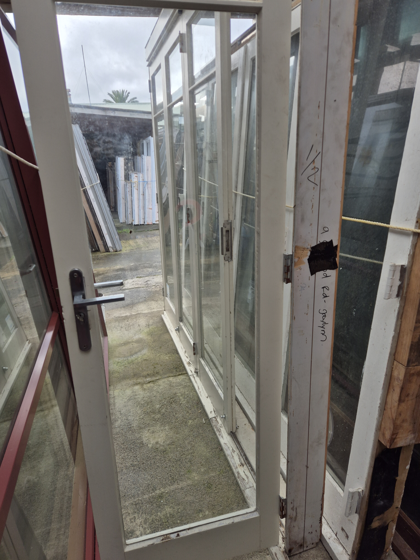 Wooden Bifolding Door with outside entry door 2220 H x 2540 W #2091