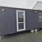 PORTABLE CABIN ON A DOUBLE AXEL TRAILER