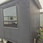 PORTABLE CABIN ON A DOUBLE AXEL TRAILER