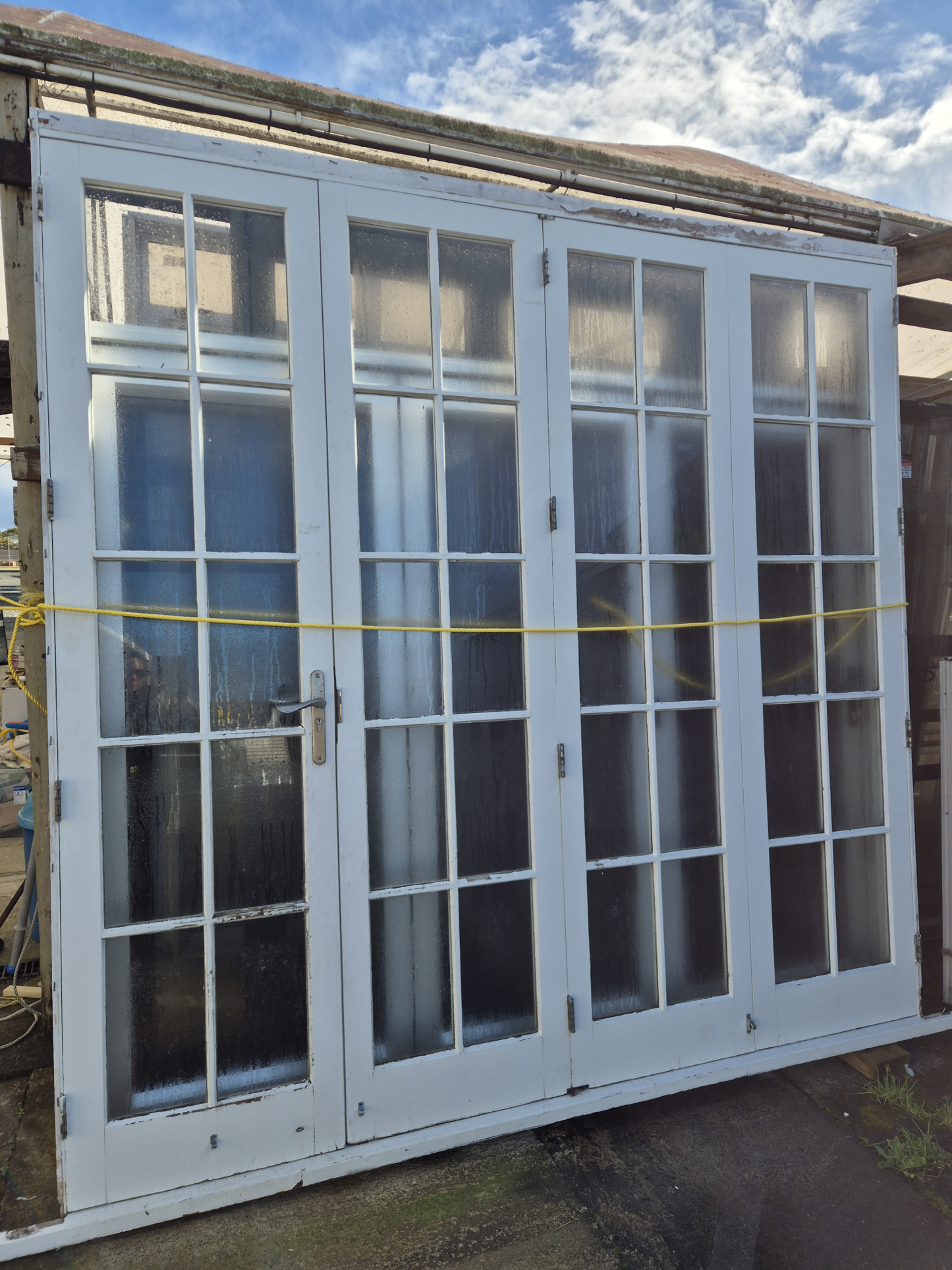 Wooden Colonial Bifolding Doors with outside access door #2512 (2 available)