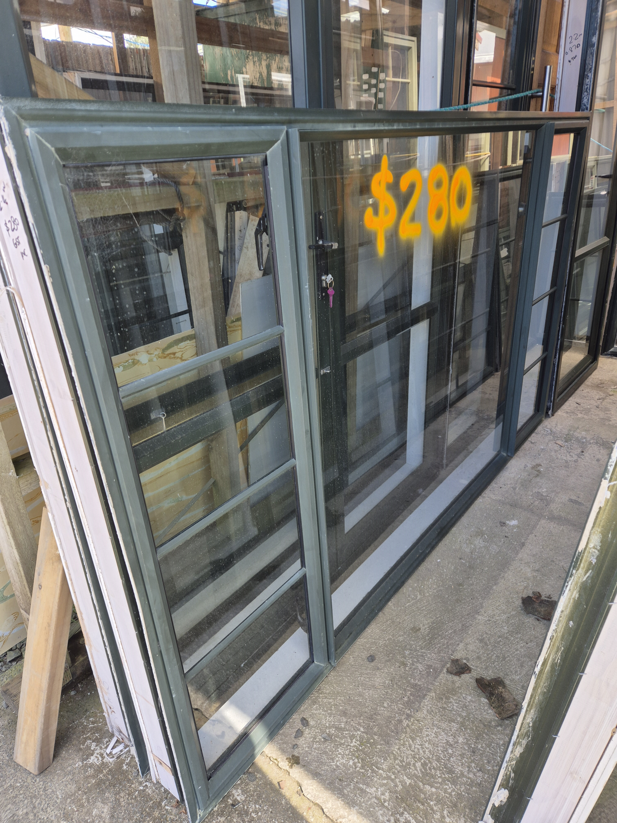 Karaka Green Aluminium window double opening- see matching joinery #2532