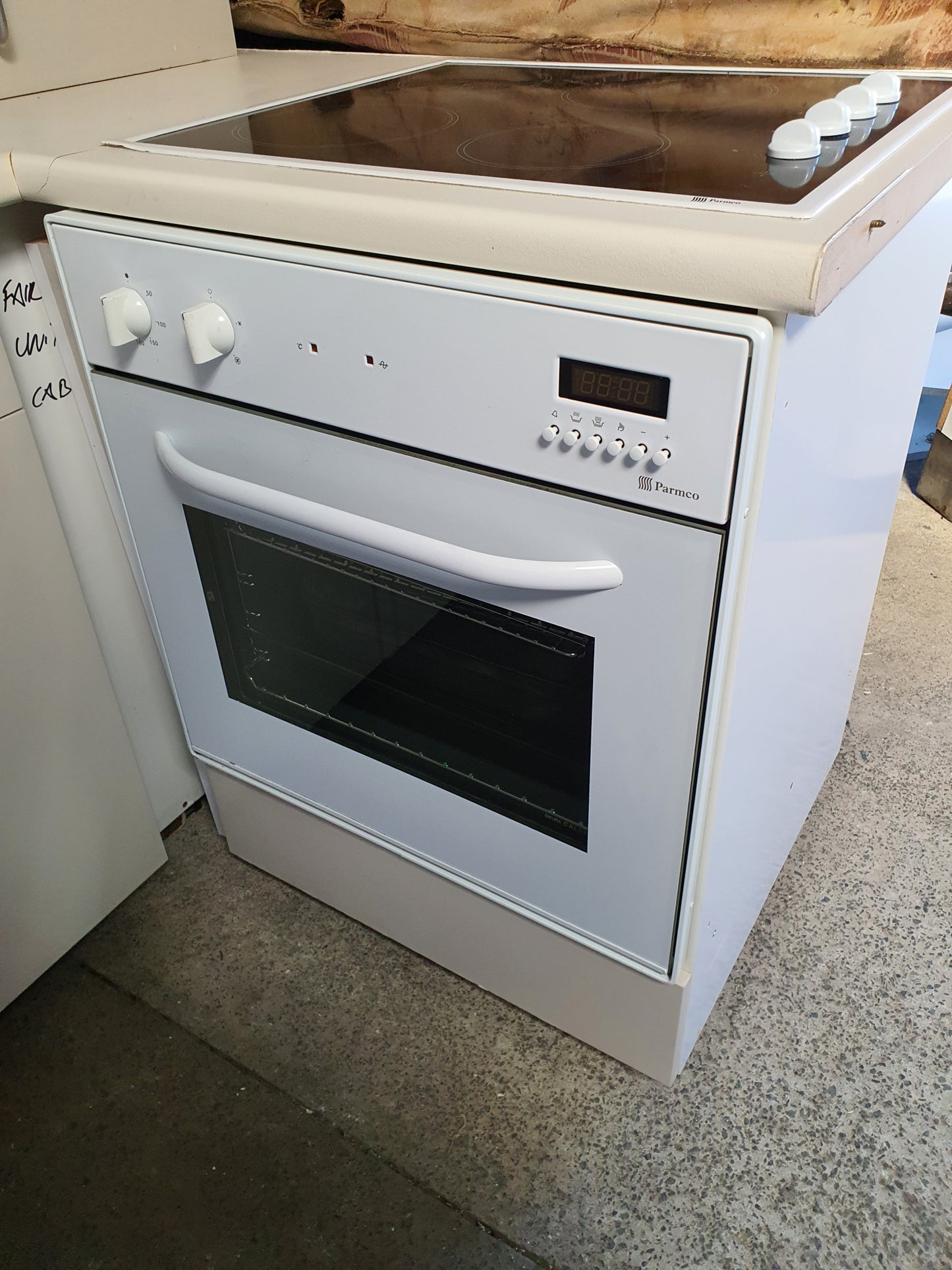 Compact Kitchen with Appliances and Corner Pantry